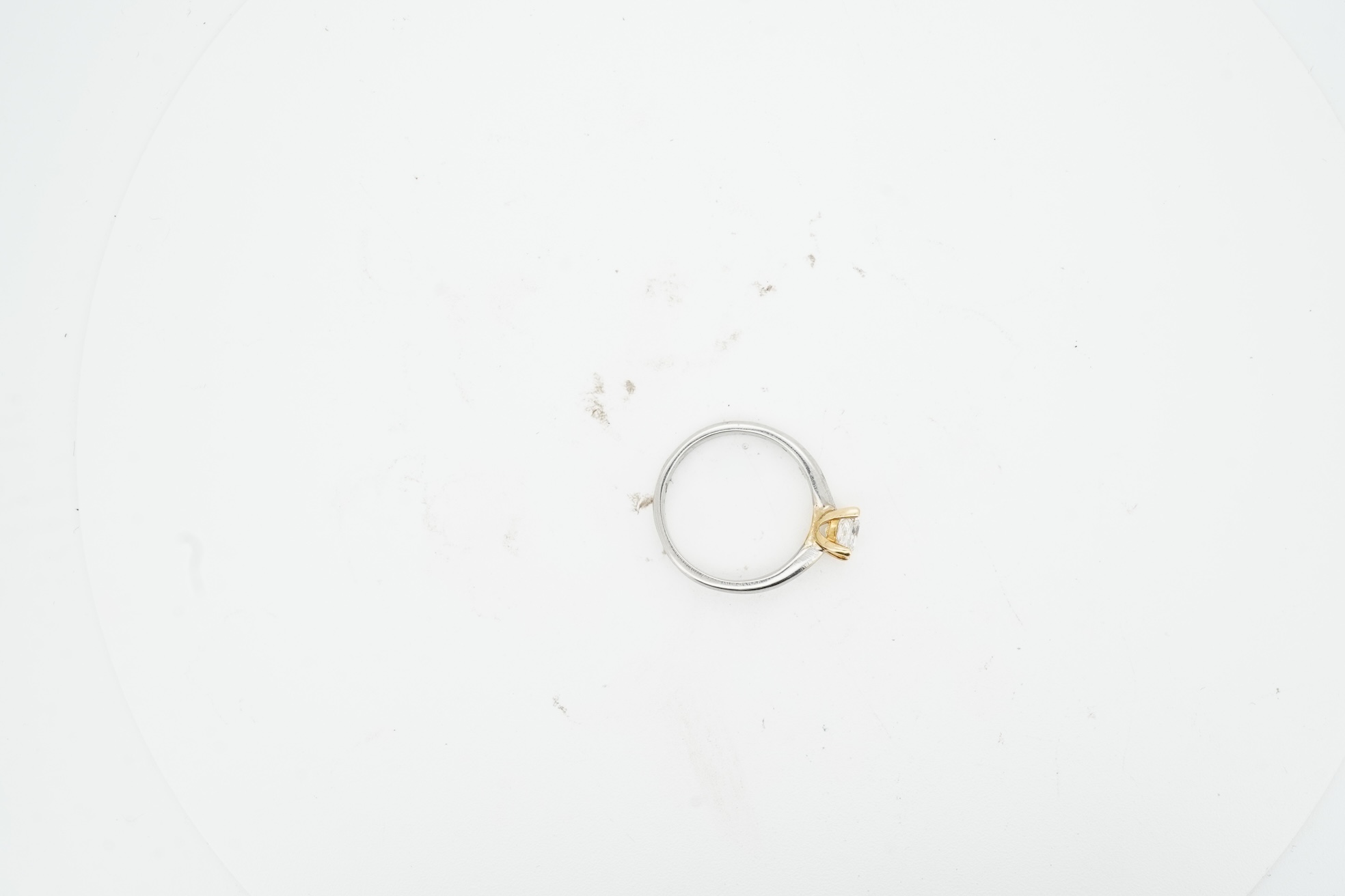 A diamond ring, claw-set with a princess-cut diamond weighing approximately 0.58 carats, mounted in platinum, size F1/2, British hallmarks, gross weight approximately 2 grams